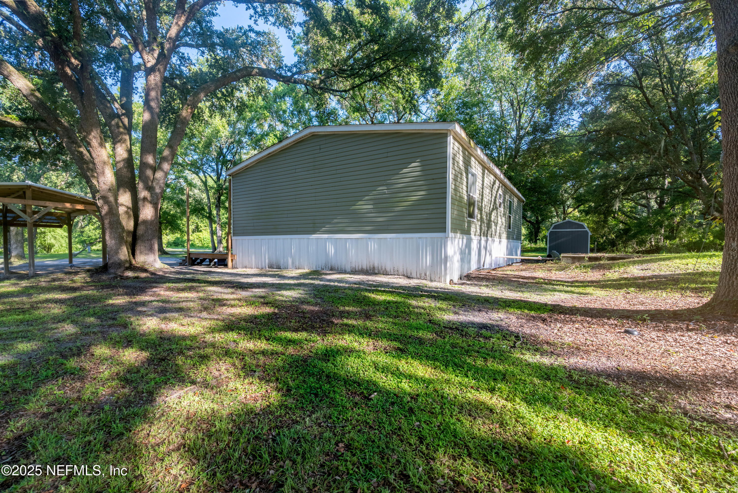 7236 Southeast 163rd Lane Lake Butler, FL 32054 - Photo 6 of 35 a backyard of a house with lots of green space