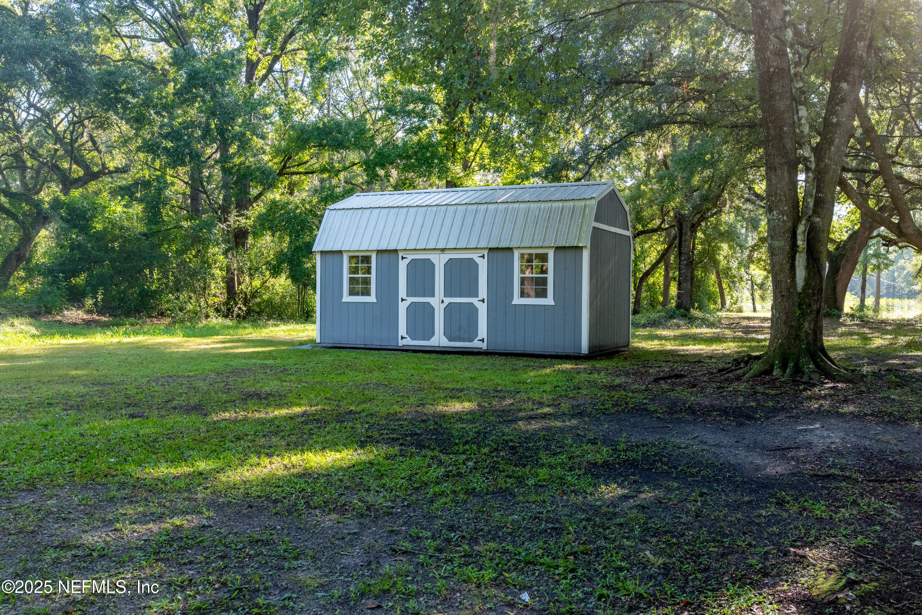 7236 Southeast 163rd Lane Lake Butler, FL 32054 - Photo 7 of 35 a view of a house with backyard and garden