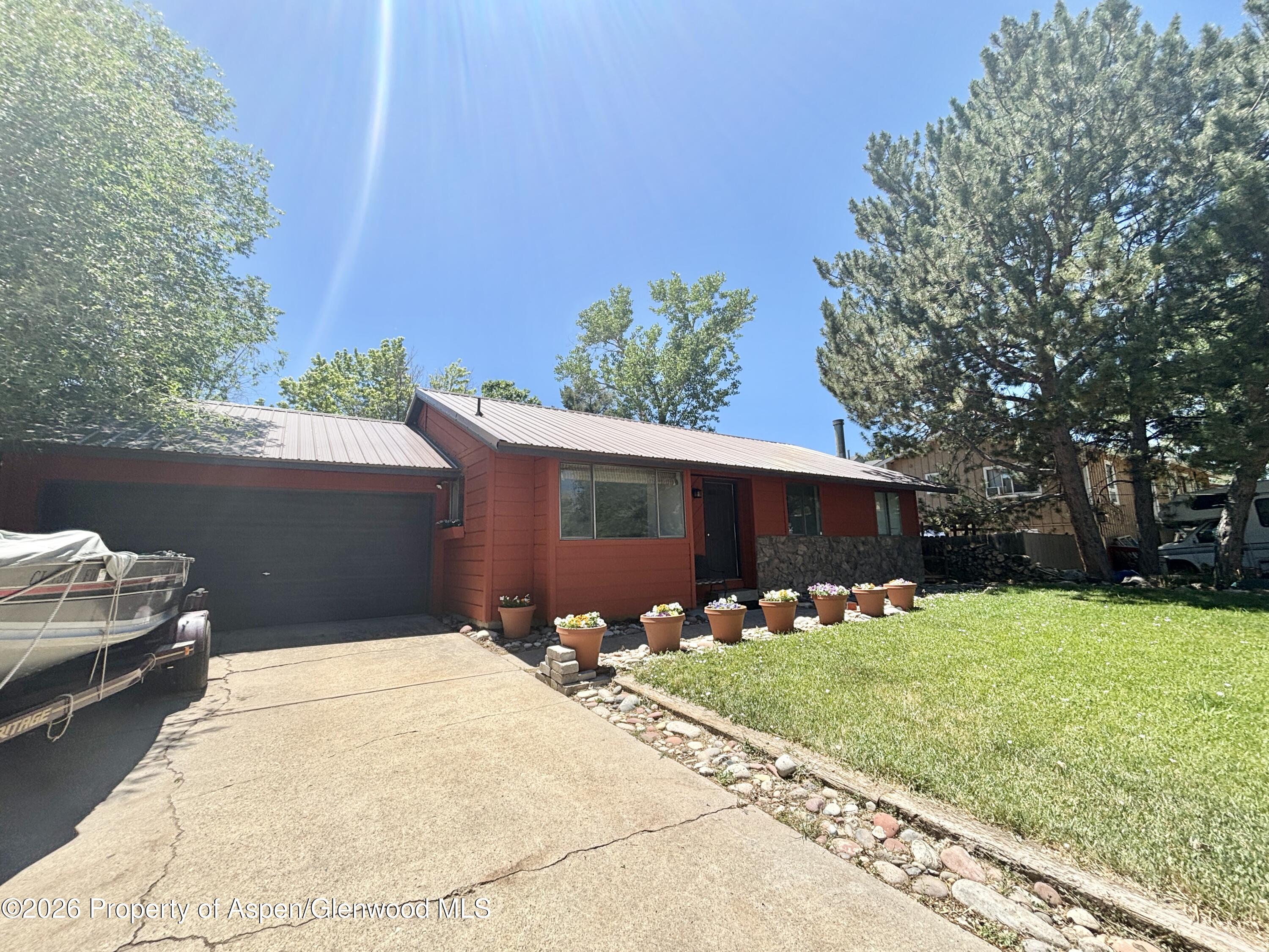 1623 West 7th Street Rifle, CO 81650 - Photo 3 of 21 a front view of house with yard