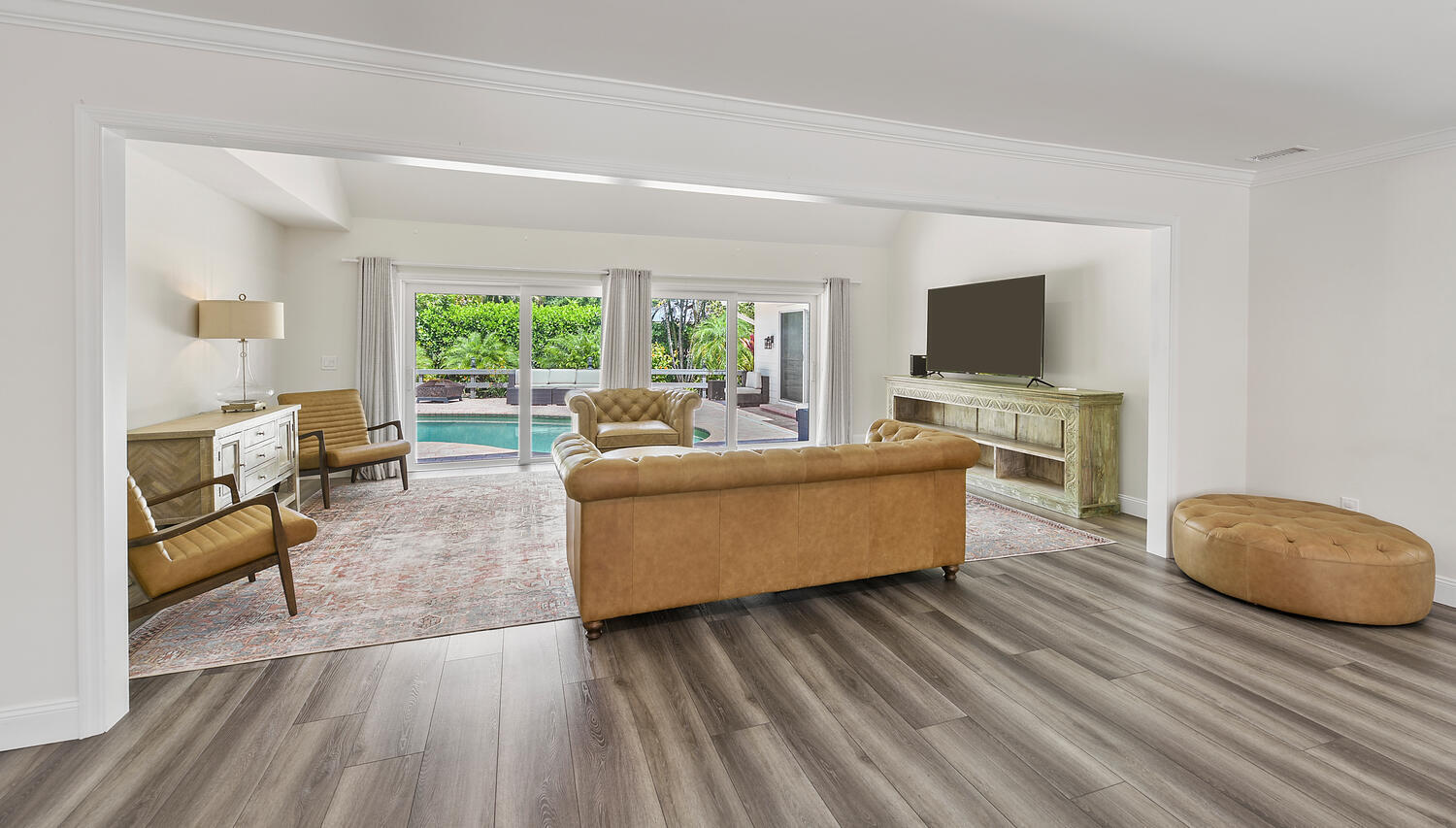 7 Lantana Lane Sewall's Point, FL 34996 - Photo 2 of 4 a living room with furniture and a flat screen tv