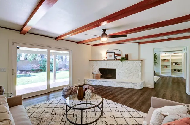 a living room with furniture and a window