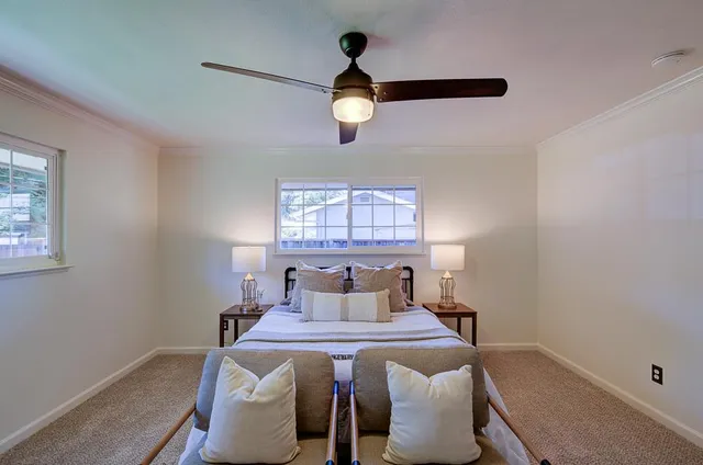 a bedroom with a bed and window