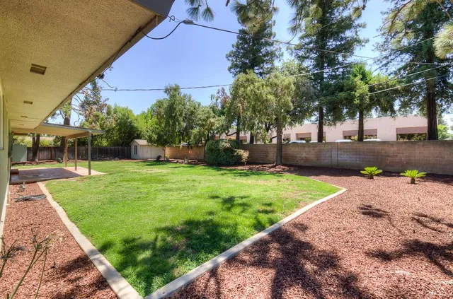 a view of a backyard with a garden