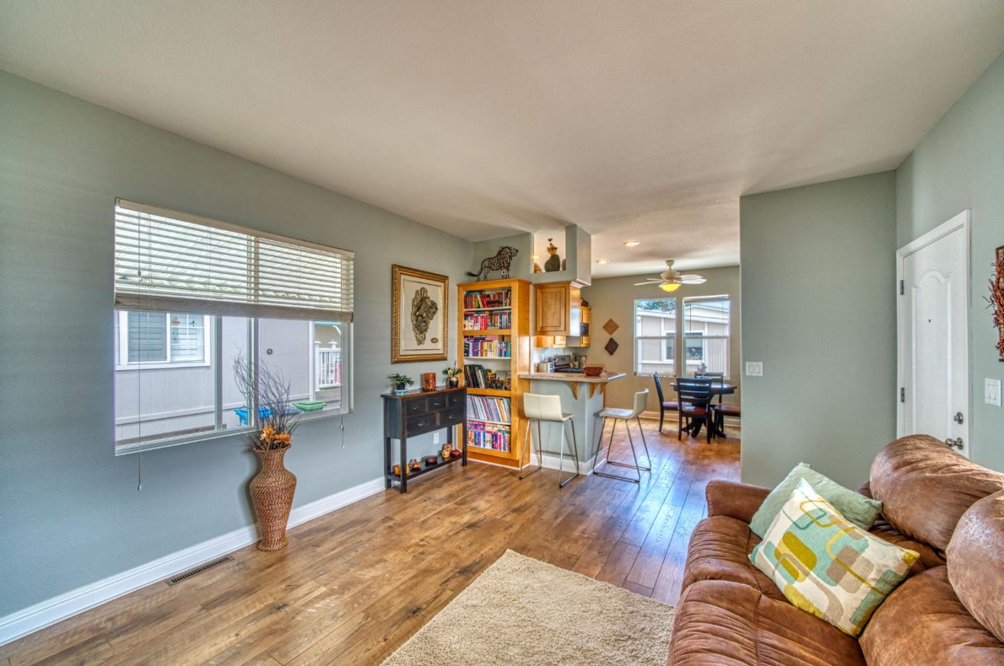 7 Lighthouse Road, Unit 7 Half Moon Bay, CA 94019 - Photo 12 of 22 a living room with furniture and a wooden floor
