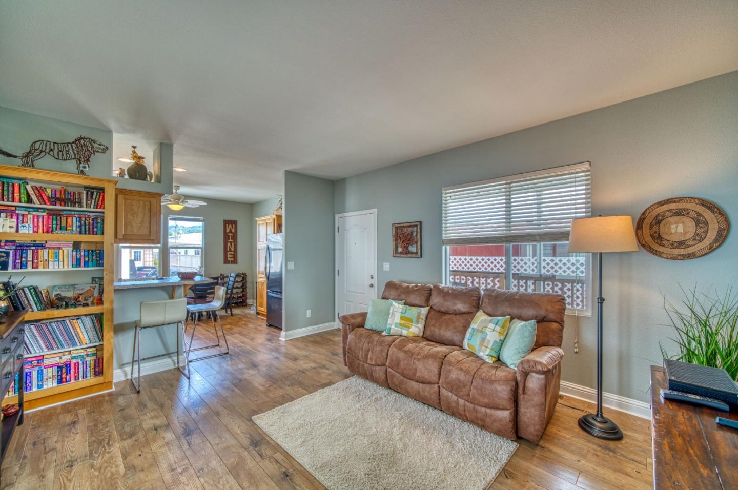 7 Lighthouse Road, Unit 7 Half Moon Bay, CA 94019 - Photo 13 of 22 a living room with furniture and a book shelf