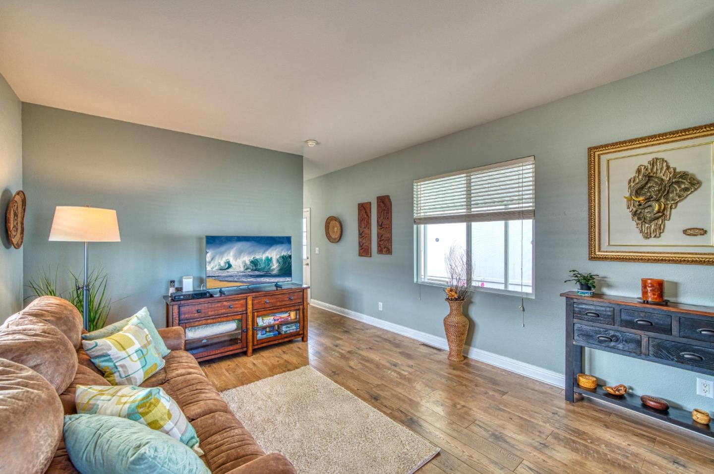 7 Lighthouse Road, Unit 7 Half Moon Bay, CA 94019 - Photo 14 of 22 a living room with furniture a rug and a window
