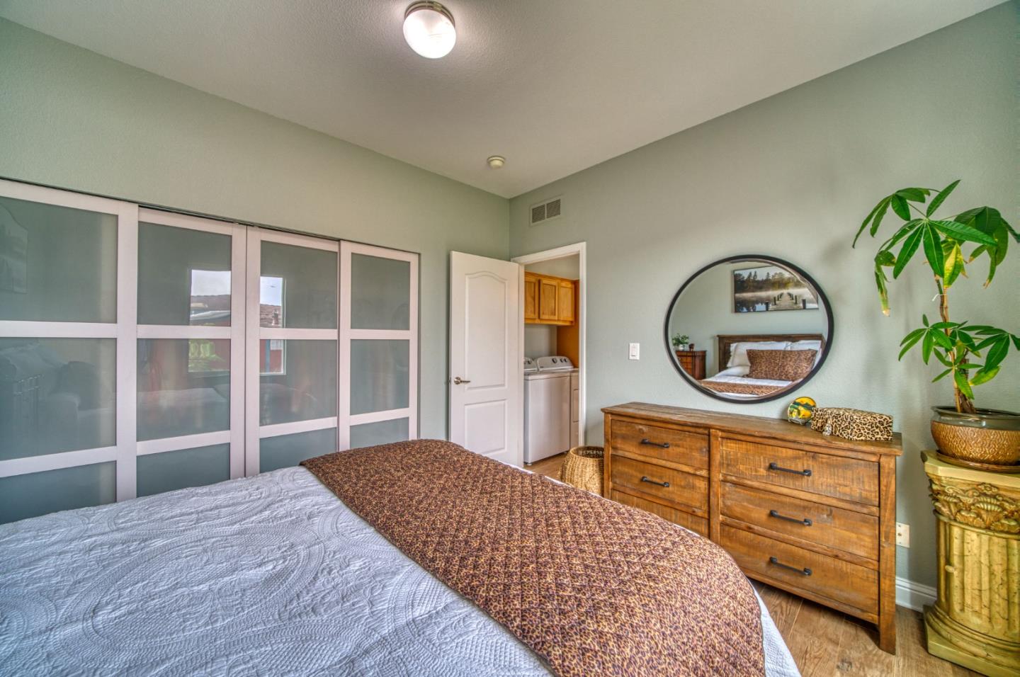 7 Lighthouse Road, Unit 7 Half Moon Bay, CA 94019 - Photo 18 of 22 a bedroom with a bed and a dresser