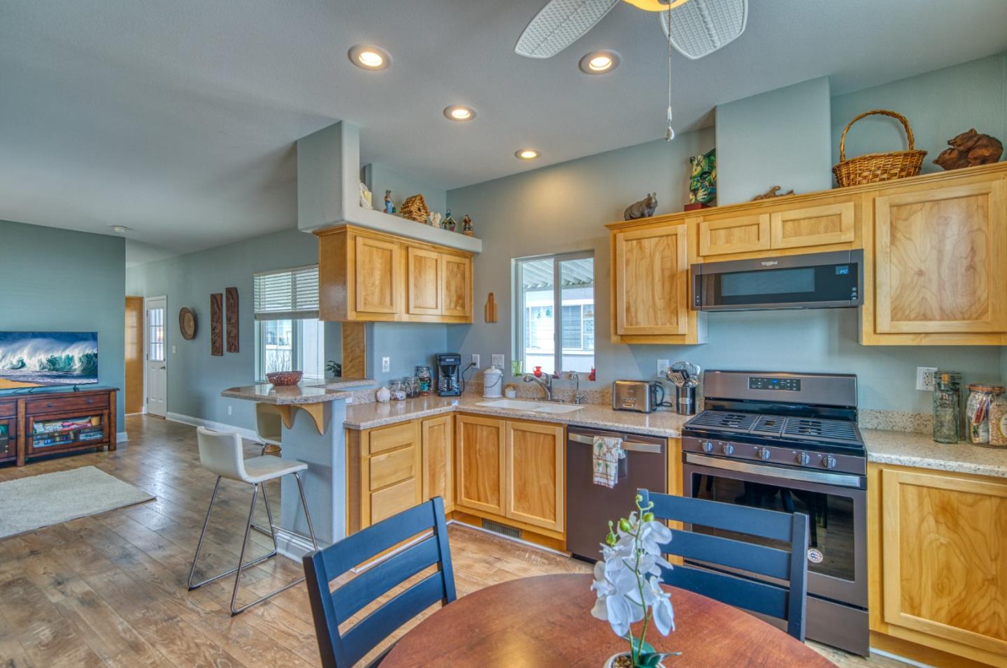7 Lighthouse Road, Unit 7 Half Moon Bay, CA 94019 - Photo 7 of 22 a kitchen with a sink stove and cabinets