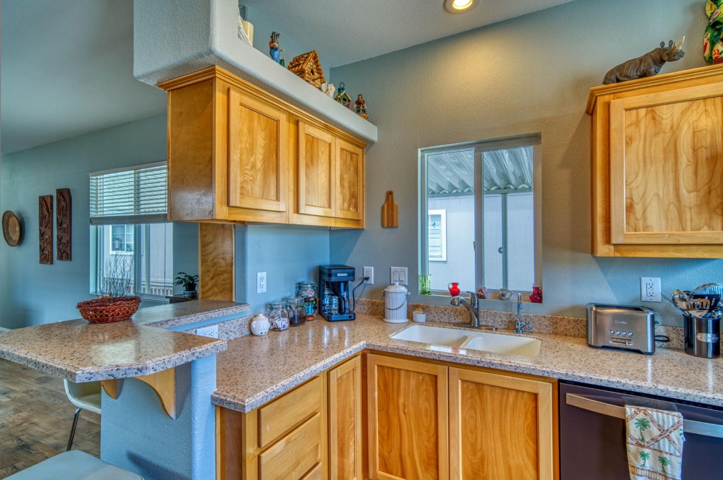 7 Lighthouse Road, Unit 7 Half Moon Bay, CA 94019 - Photo 10 of 22 a kitchen with stainless steel appliances granite countertop a sink a stove and cabinets