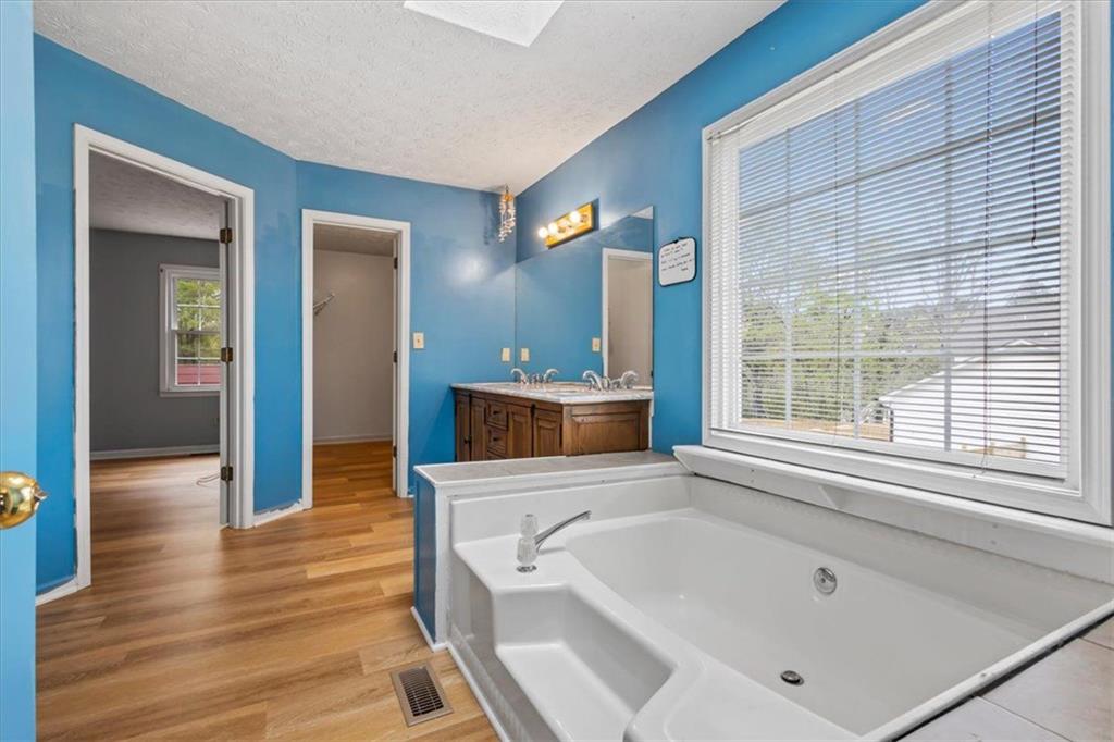 30 Paces Meadows Lane Dallas, GA 30157 - Photo 20 of 40 a bathroom with a bathtub and a sink