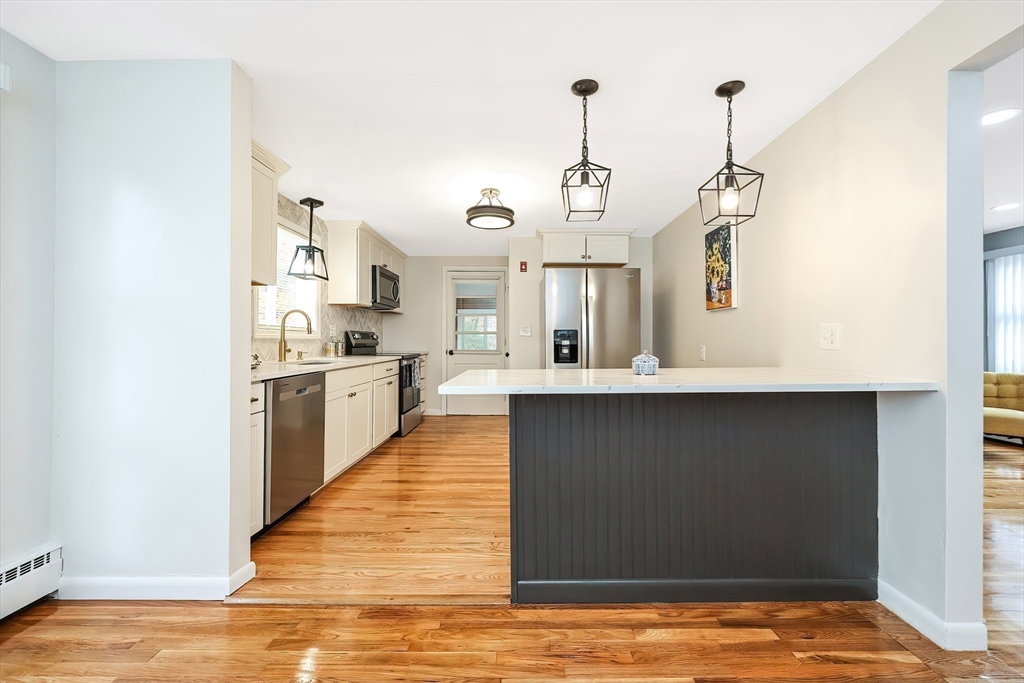 35 Deerfield Road Sharon, MA 02067 - Photo 1 of 31 a view of a kitchen with a sink and wooden floor