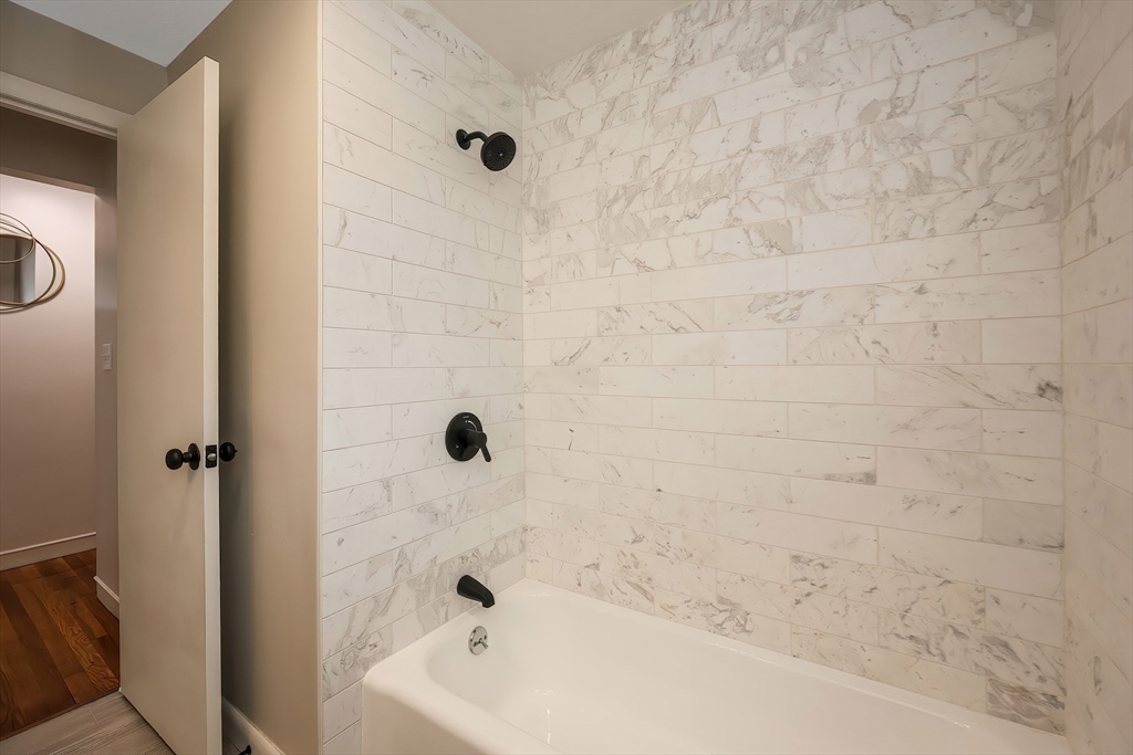 35 Deerfield Road Sharon, MA 02067 - Photo 12 of 31 a bathroom with a bathtub