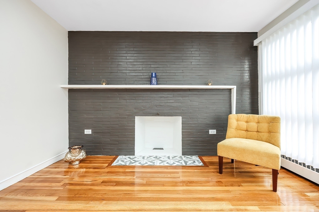35 Deerfield Road Sharon, MA 02067 - Photo 24 of 31 a view of a livingroom with wooden floor and a fireplace