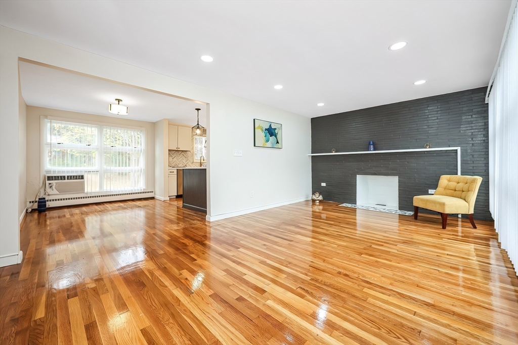 35 Deerfield Road Sharon, MA 02067 - Photo 8 of 31 a view of a room with wooden floor and seating space