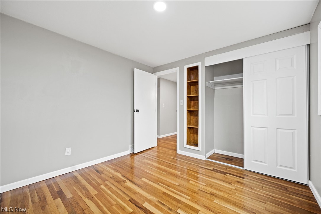 11417 Snow Road Parma Heights, OH 44130 - Photo 18 of 32 bedroom featuring light hardwood flooring and a closet