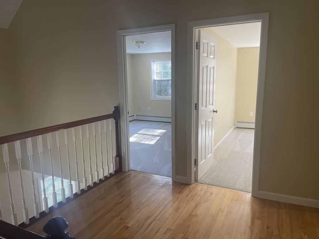 75 Downey Road North Brookfield, MA 01535 - Photo 28 of 42 a view of a hallway with wooden floor