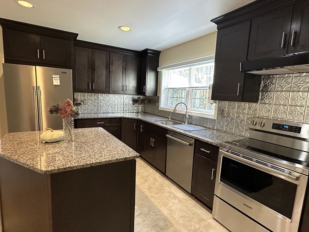75 Downey Road North Brookfield, MA 01535 - Photo 8 of 42 a kitchen with a sink dishwasher a stove top oven a refrigerator and cabinets