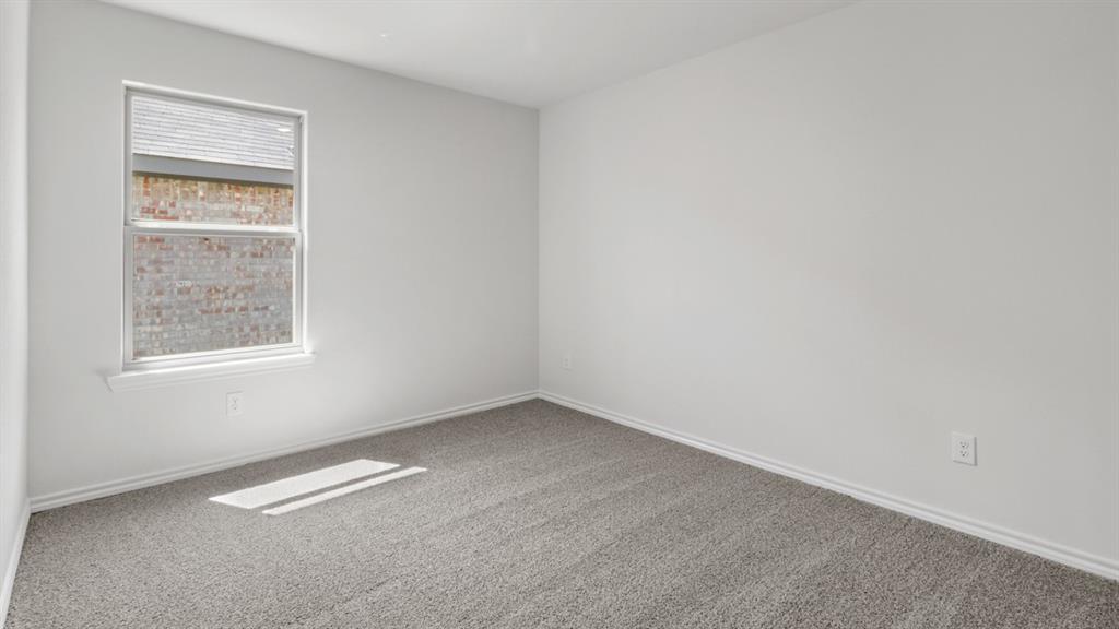 1923 Reveille Way Terrell, TX 75160 - Photo 22 of 33 Room featuring neutral white walls and gray carpeting
