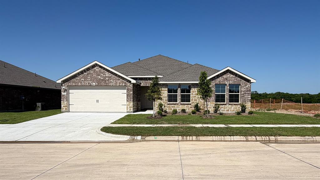 1923 Reveille Way Terrell, TX 75160 - Photo 32 of 33 Brick and stone veneer facade with a gabled roofline