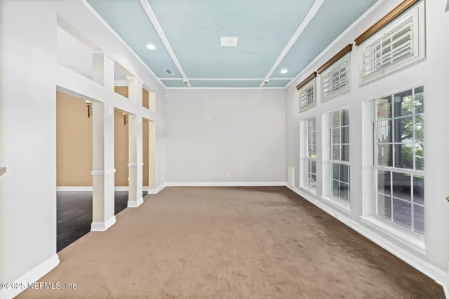 an aerial view of a house with yard swimming pool and outdoor seating