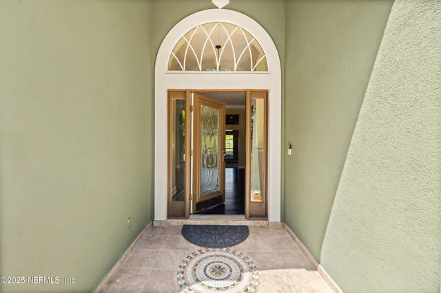 a kitchen with white cabinets and appliances