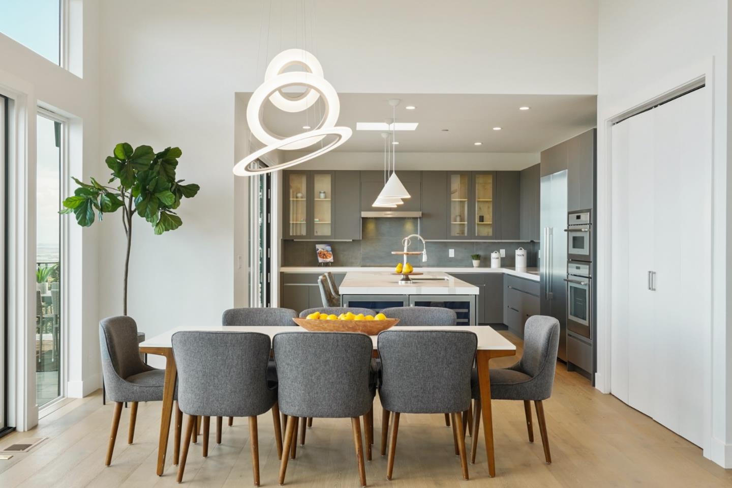 470 Erlin Drive San Carlos, CA 94070 - Photo 15 of 82 a dining room with furniture potted plants and wooden floor