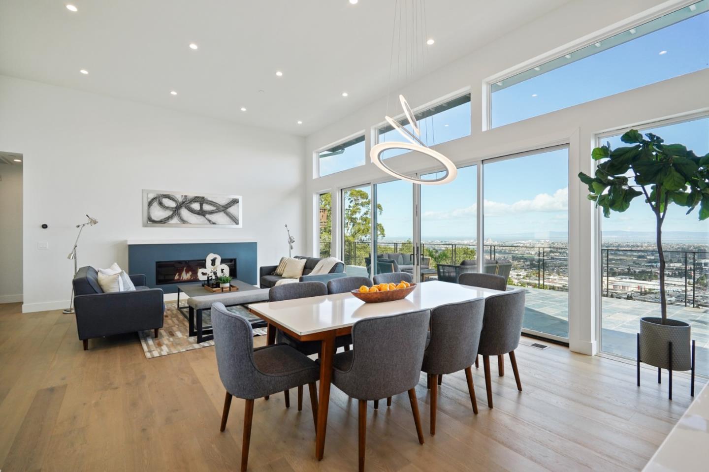 470 Erlin Drive San Carlos, CA 94070 - Photo 17 of 82 a living room with furniture a fireplace and a floor to ceiling window