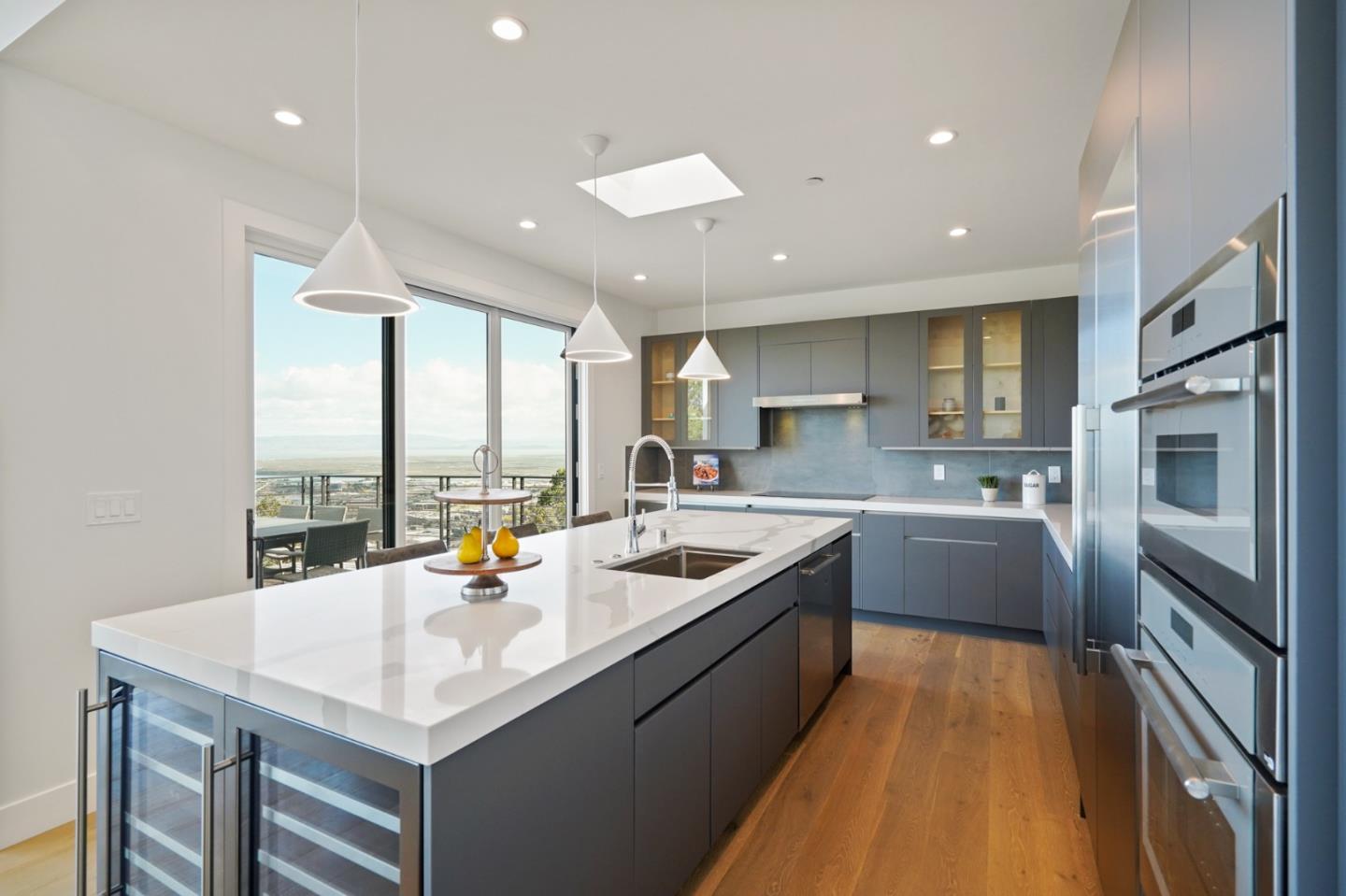 470 Erlin Drive San Carlos, CA 94070 - Photo 18 of 82 a kitchen with a sink a counter top stainless steel appliances and cabinets