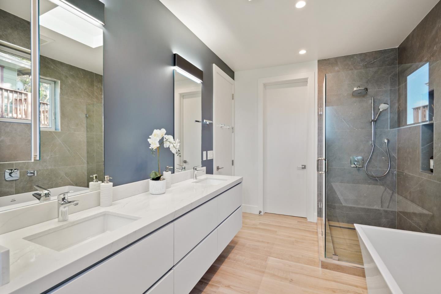 470 Erlin Drive San Carlos, CA 94070 - Photo 30 of 82 a en suite bathroom with a double vanity sink a mirror and shower