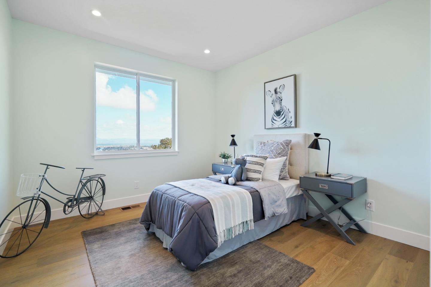 470 Erlin Drive San Carlos, CA 94070 - Photo 52 of 82 a bedroom with a bed and wooden floor