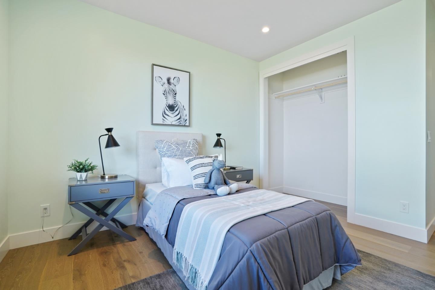 470 Erlin Drive San Carlos, CA 94070 - Photo 53 of 82 a bedroom with a bed and wooden floor