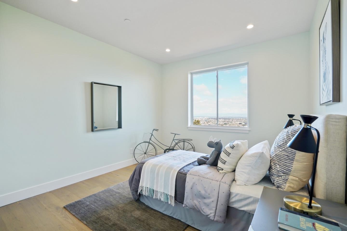 470 Erlin Drive San Carlos, CA 94070 - Photo 54 of 82 a bedroom with a bed and wooden floor