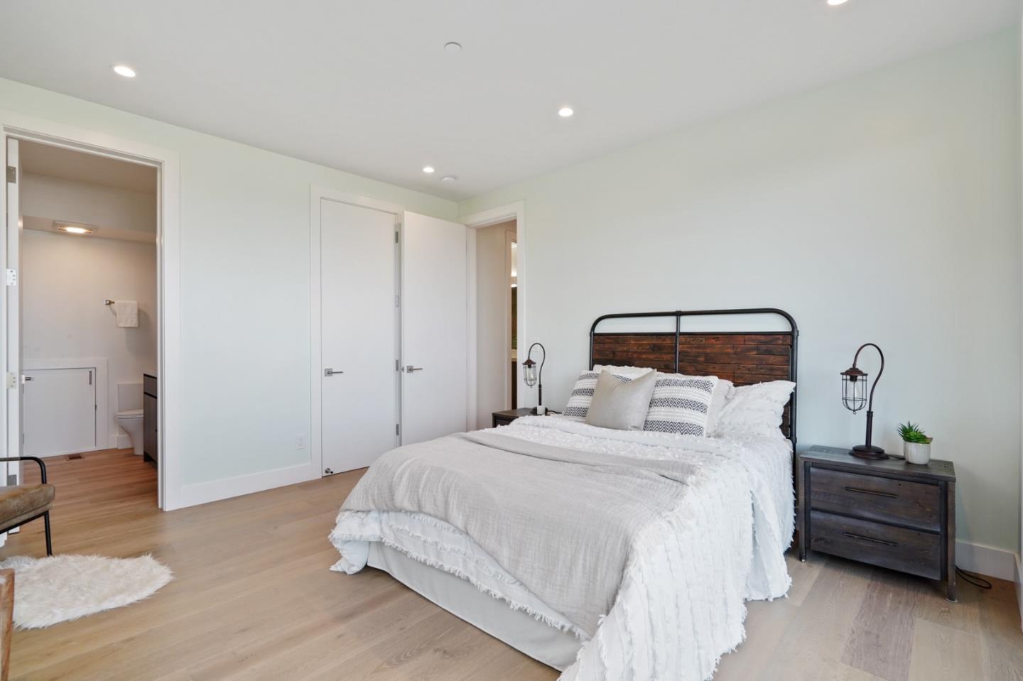 470 Erlin Drive San Carlos, CA 94070 - Photo 59 of 82 a bedroom with a bed and a mirror