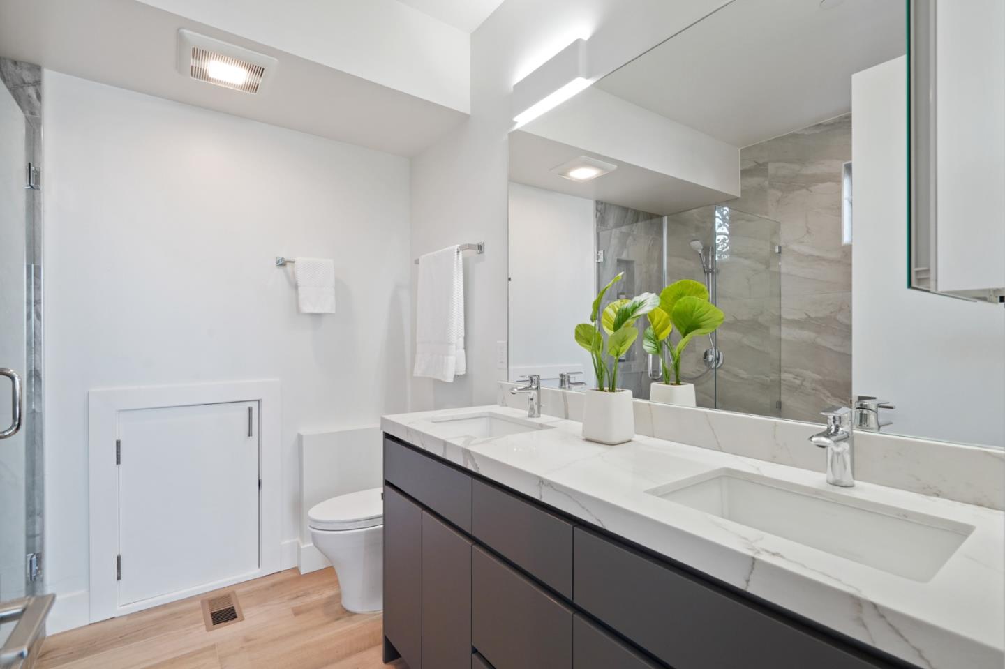 470 Erlin Drive San Carlos, CA 94070 - Photo 60 of 82 a bathroom with a double vanity sink and a mirror