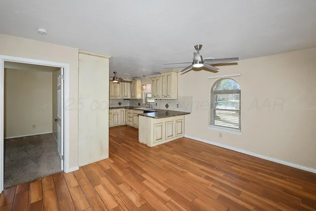 a view of a kitchen cabinets and wooden floor