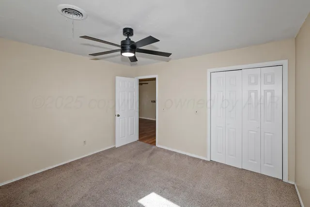 a hallway with sink and mirror with wooden floor