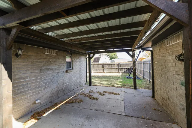 a view of a garage with air conditioner and stairs
