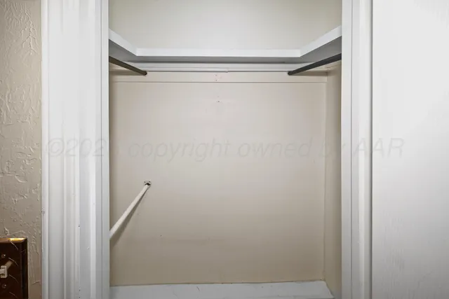 a view of a house with a large tree