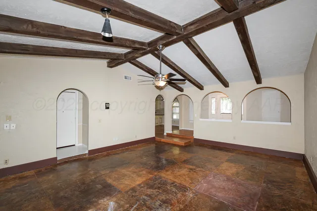 a kitchen with a sink a stove a refrigerator and cabinets