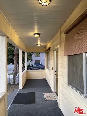 a view of a kitchen with a sink and a window