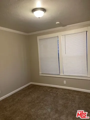 an empty room with a empty space and window