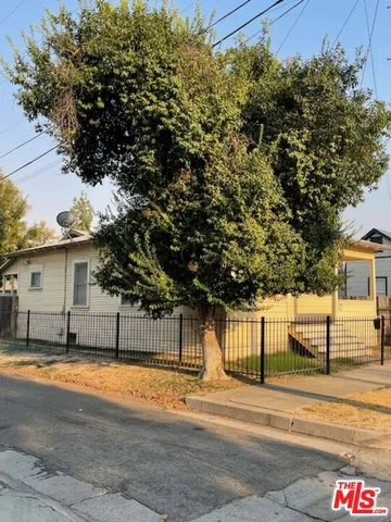 a view of a house with a tree