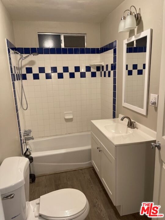 1608 E Street Bakersfield, CA 93301 - Photo 23 of 34 a bathroom with a sink a toilet and shower
