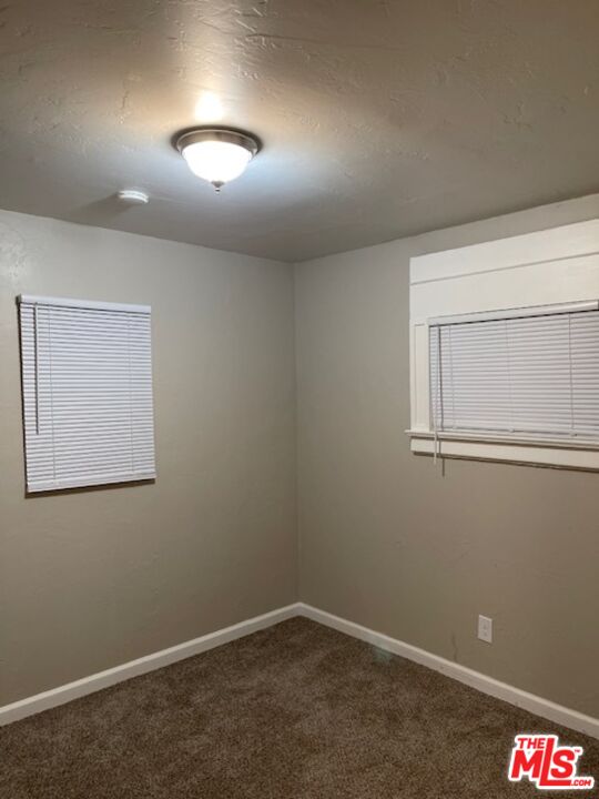 1608 E Street Bakersfield, CA 93301 - Photo 25 of 34 an empty room with a empty space and windows