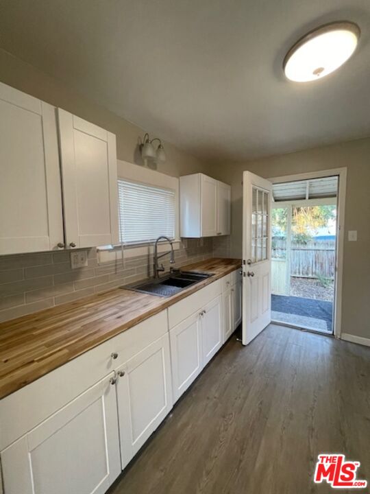 1608 E Street Bakersfield, CA 93301 - Photo 8 of 34 a large kitchen with cabinets