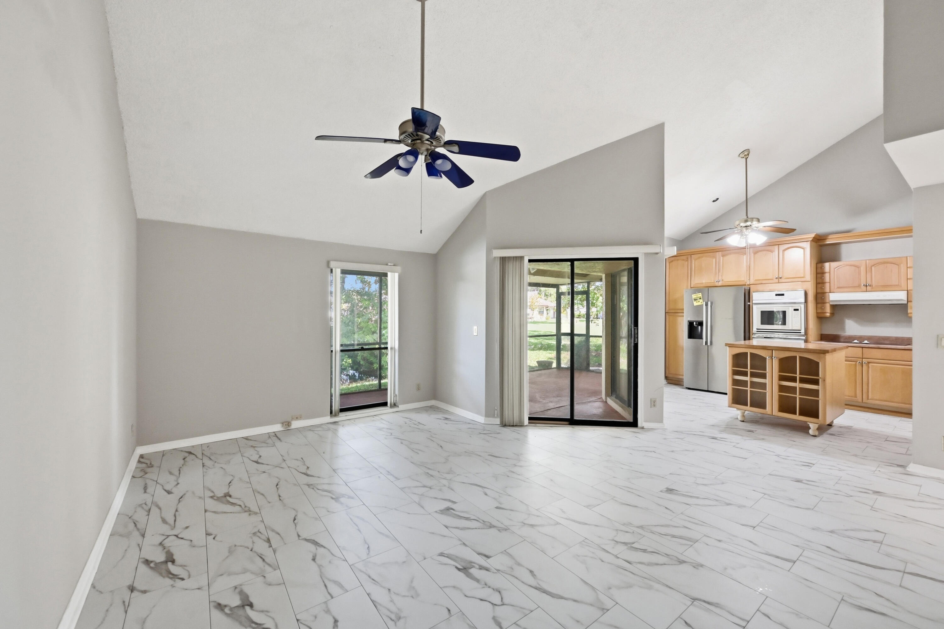 9364 Ketay Circle, Unit 5 Boca Raton, FL 33428 - Photo 11 of 42 a view of an empty room with a window