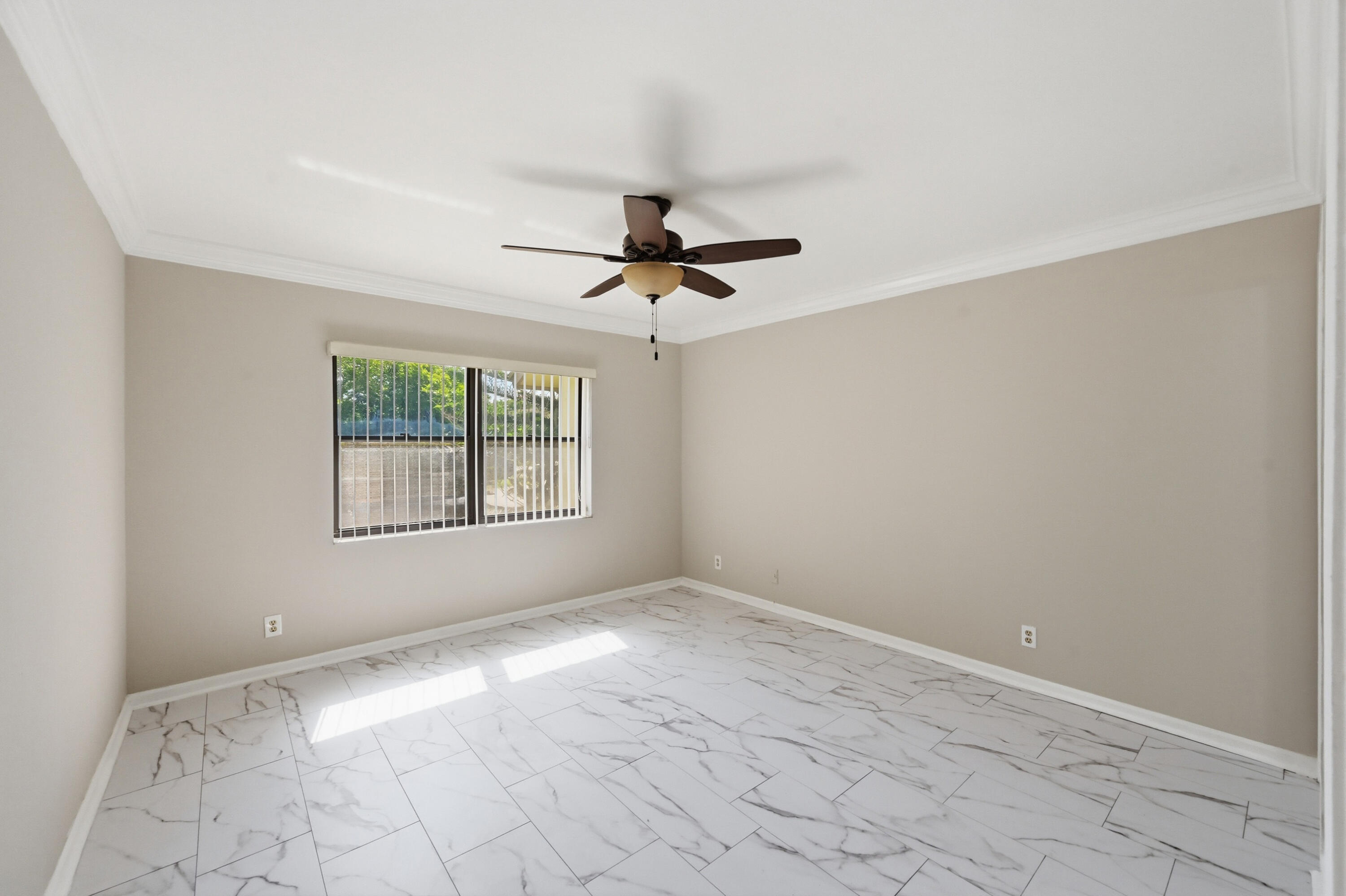 9364 Ketay Circle, Unit 5 Boca Raton, FL 33428 - Photo 13 of 42 wooden floor in an empty room with a window