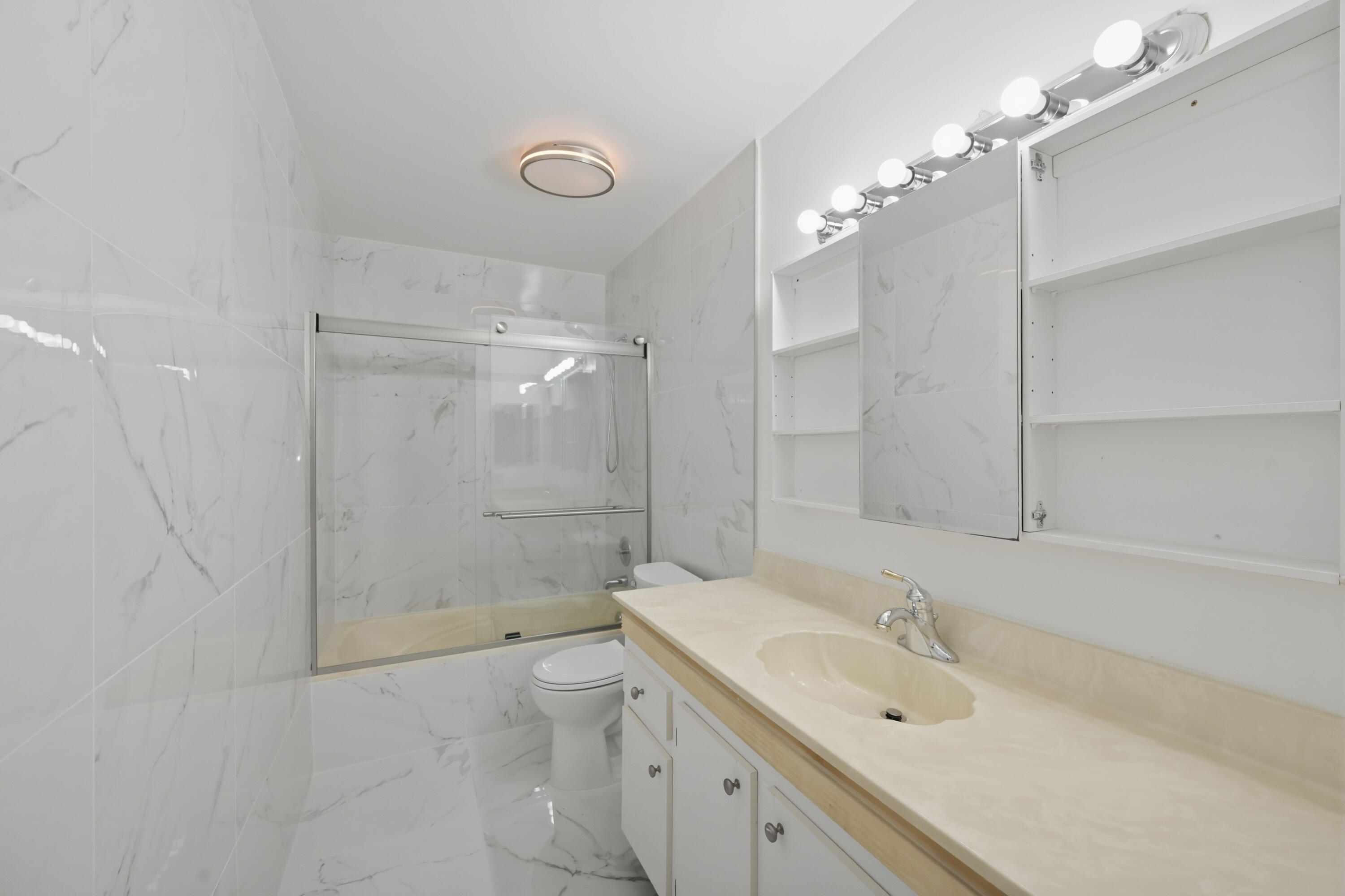 9364 Ketay Circle, Unit 5 Boca Raton, FL 33428 - Photo 16 of 42 a bathroom with a sink double vanity granite shower and a mirror