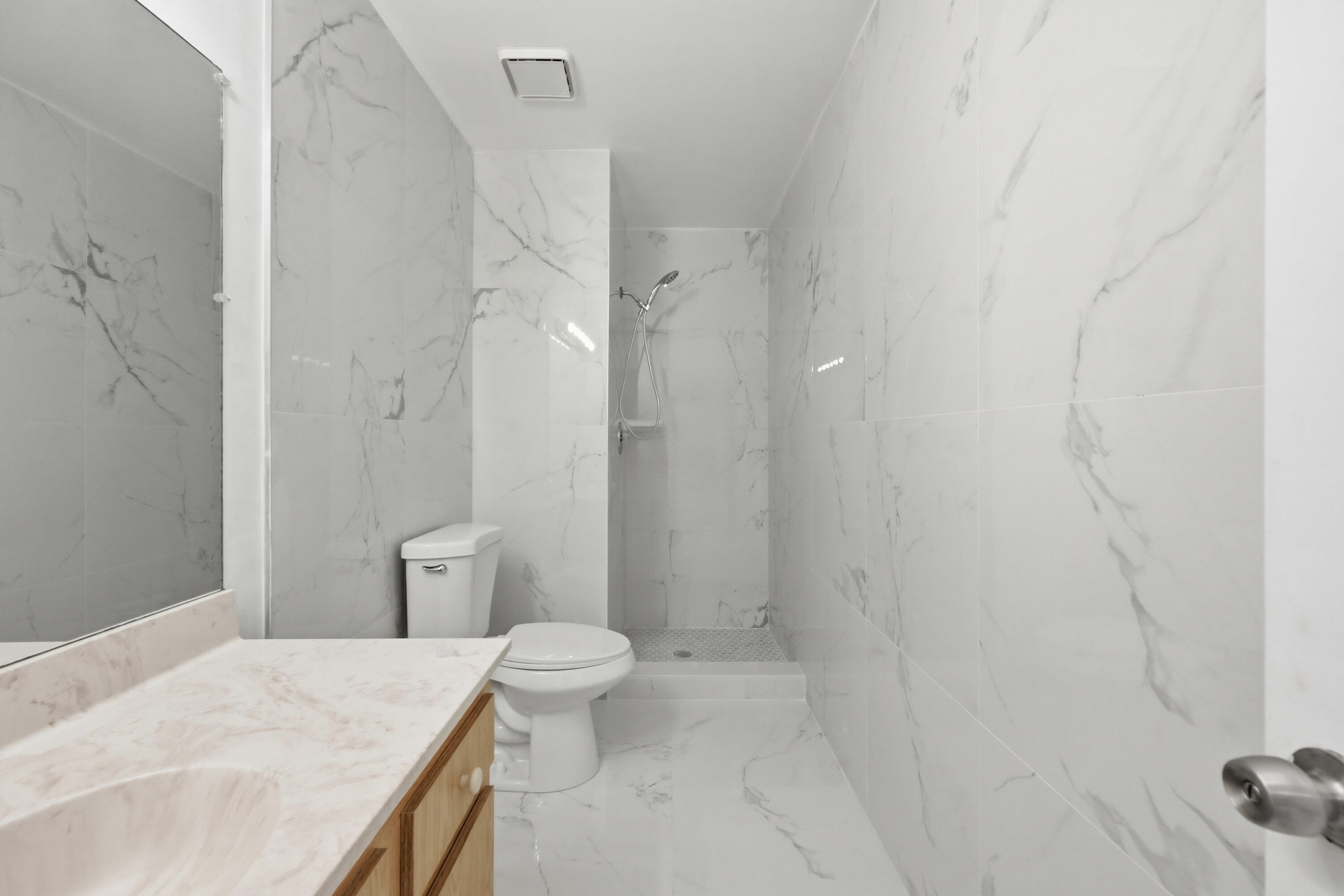 9364 Ketay Circle, Unit 5 Boca Raton, FL 33428 - Photo 26 of 42 a bathroom with a granite countertop sink toilet and shower