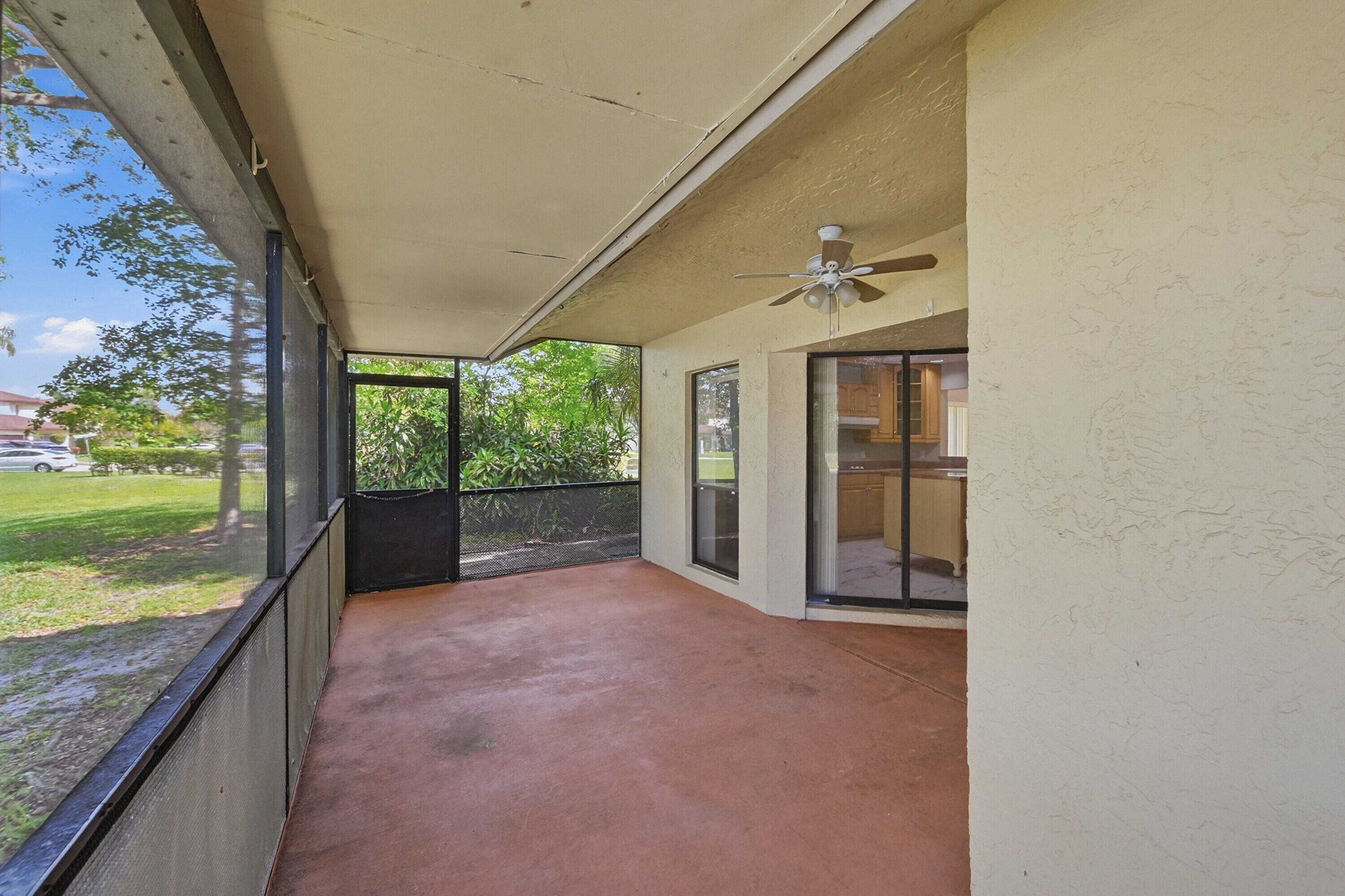 9364 Ketay Circle, Unit 5 Boca Raton, FL 33428 - Photo 30 of 42 a view of a porch and garden